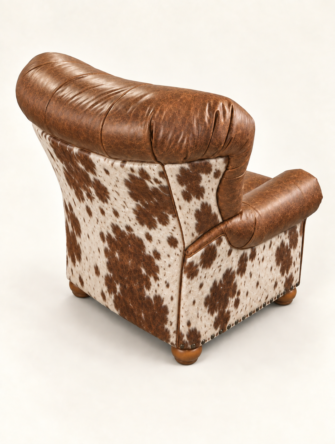 Speckled hair-on cowhide covering the outside back and arms of a Cowpoke chair