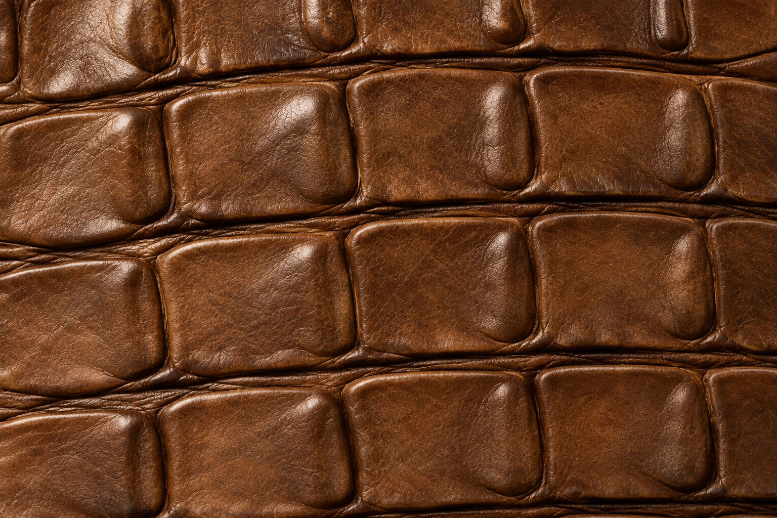Illustrative close-up of Oil Money Hacienda leather with broad rectangular croc embossing